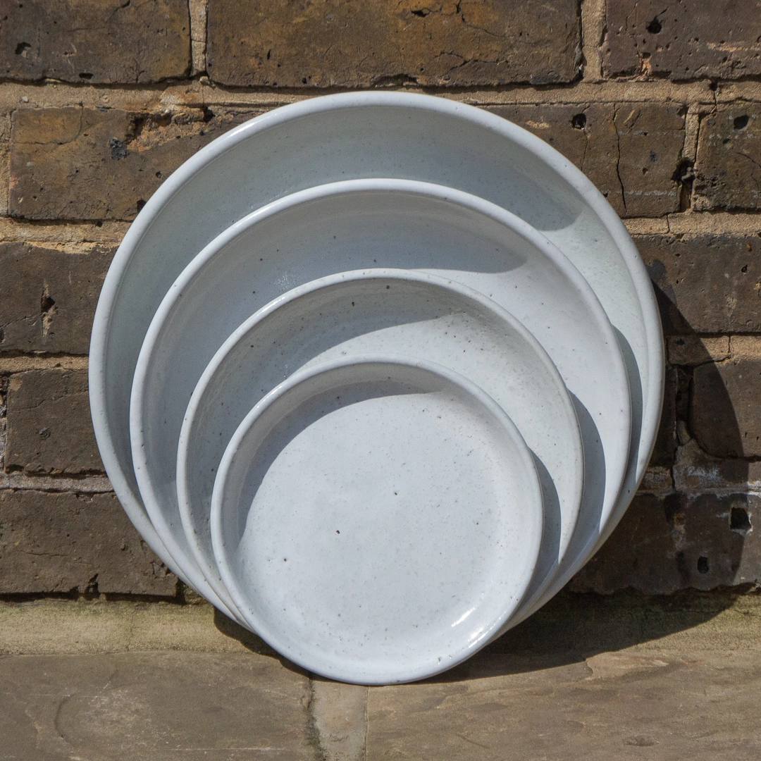 white glazed ceramic plant saucer outdoor        
        <figure class=